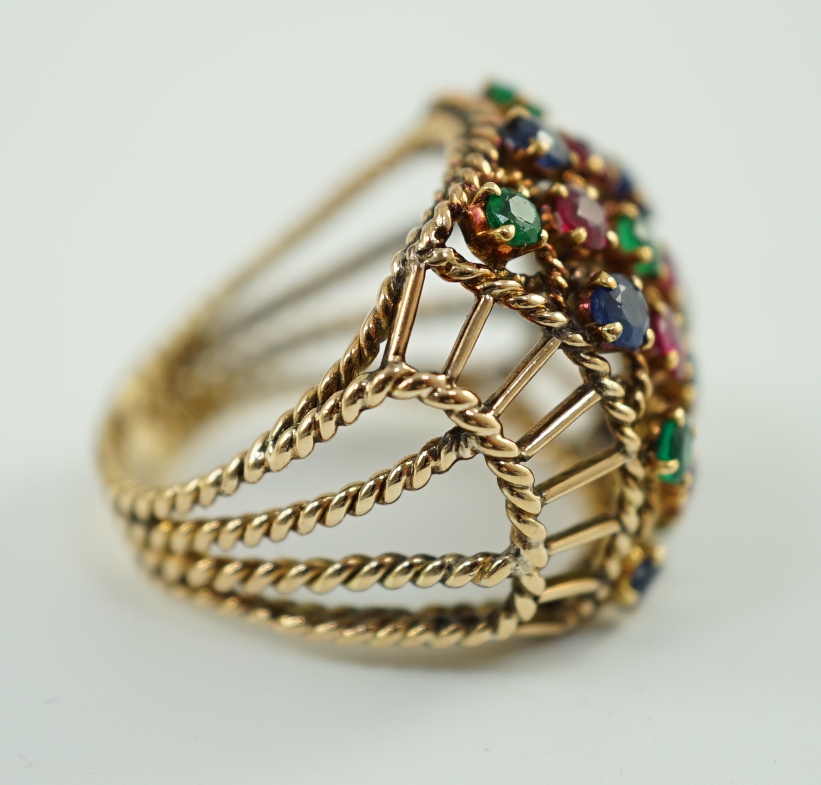 An Indian gold, ruby, sapphire and emerald cluster set dress ring